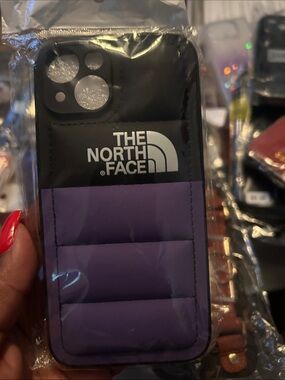 The North Face Purple & Black Puffer iPhone Case iPhone 14